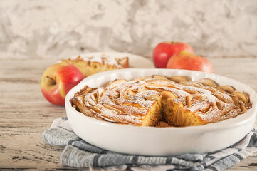 Classic American apple pie on wooden rustic background. Thanksgiving, autumn food, concept of...