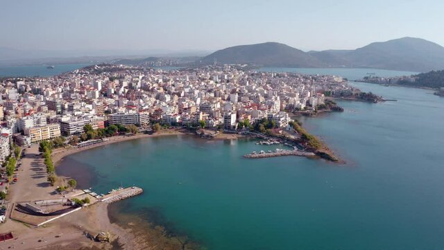 4k drone forward video (Ultra High Definition) of Chalcis town, Greece. Wonderful morning seascape of Aegean sea, North Euboean Gulf. Superb summer scene of Euboea island, Greece, Europe.