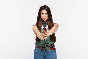 Obraz premium young woman with shiny hair holding hair dryer while aiming isolated on grey