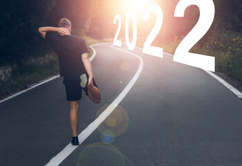 Fototapeta na wymiar We end the year 2021 and start the new year 2022 with new goals and plans. Start New Year