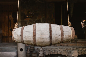 a churn is a barrel hanging on two ropes and designed for whipping milk into a more fatty product