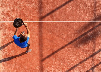 View from above of a professional paddle tennis player who has just hit the ball © REC Stock Footage