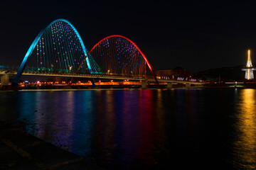 Naklejka na ściany i meble Daejeon expro bridge at night in daejeon with reflection,korea. The light bridges.