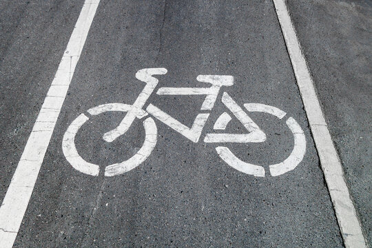Bicycle painted on asphalt, marking track for cyclists