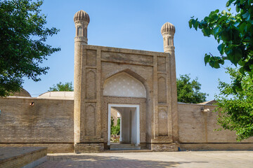 Fototapeta na wymiar Entrance portal to Ruhabad madrasah (with mausoleum of same name) in Samarkand, Uzbekistan. Built in middle of XIX, included in UNESCO heritage