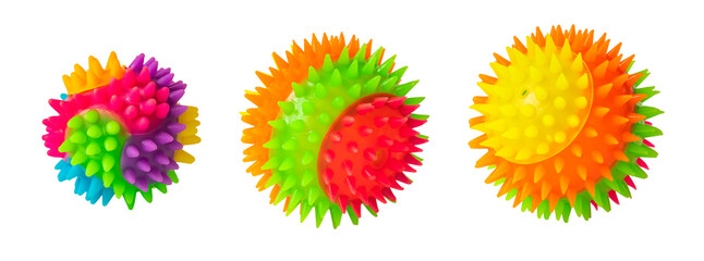 Massage rainbow multi colored prickly three balls isolated on white. Colorful bright isolated spiky toy ball  close up.  Rubber ball for games with dog or cat. Massage ball similar to coronavirus.