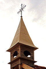 General view and architectural details of a brick Catholic chapel from 1863 and a wooden part added...