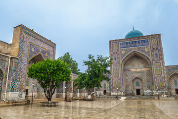 Western and southern iwans of Nadir Divan-Begi madrasah in Samarkand, Uzbekistan. Building is...