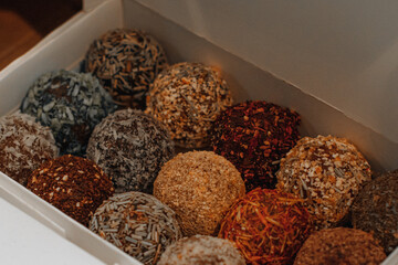Assorted handmade truffle chocolates candies made from organic ingredients. Raw food diet concept.