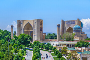 Panorama of Bibi-Khanym mosque complex in Samarkand, Uzbekistan. You can see alley and people...
