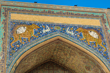 Details of facade of madrasah depicting hunting scene. Combination of sun and lion is one of...