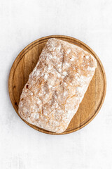 Loaf of rye bread top view. Bread on cutting board