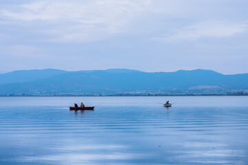Fisherman on Boat at Lake