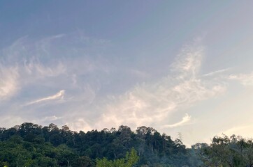 A green hill with beautiful sky in the background