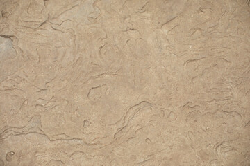 The texture of the stone. Brown stone in detail. The surface of the rock.