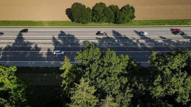 Drone Aerial view of a german Autobahn motorway highway in 4k UHD, lots of cars traffic