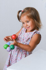 girl with colorful little balls
