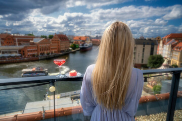 View from the tars to the old town of Gdańsk, the girl admires the city, Poland	 - obrazy, fototapety, plakaty