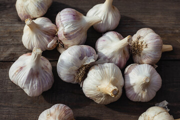 Garlic Cloves and Bulb in vintage wooden table.