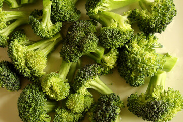 Warm close up shot of raw broccoli.