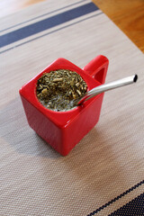 Shot from above of red mate, traditional argentine drink.