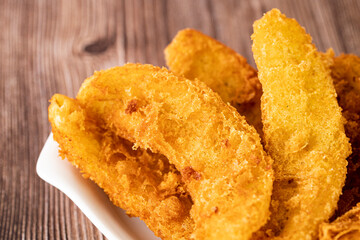 Close-up of freshly cooked fried bananas. Selective focus points. Blurred background.