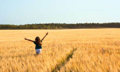 girl jumping in the field