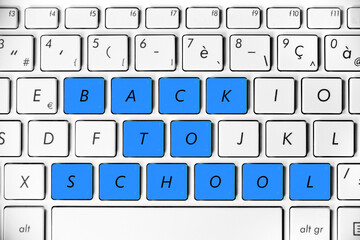Back to school written on a computer keyboard, online study concept