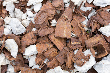 rusty remains of the rations of World War I on the Marmolada group. Alps, Dolomites, Passo Fedaia, Trento, Italy