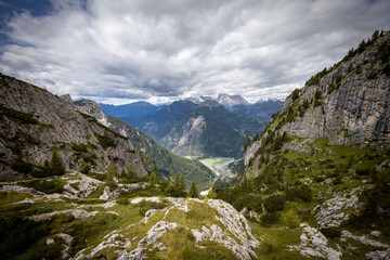 Fototapeta na wymiar Alleghe Lake seen from Forcella Coldai on Civetta group. Alps, Dolomites, Alleghe, Belluno, Italy