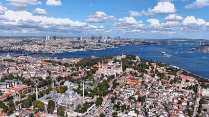 Fototapeta premium Istanbul Aerial View in Turkey 6K Several landmarks inc famous Hagia Sophia Grand Mosque, The Blue Mosque - Sultan Ahmed, Topkapi Palace Museum, with the beautiful Bosporus cityscape in the background