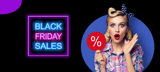 Excited surprised pinup beautiful woman with % procent text. Pin up shocked girl with open mouth. Blond model in plaid shirt - retro fashion and vintage concept. Black Friday sales neon light sign.