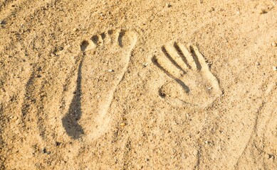 Handprint and Footprint in the Sand
