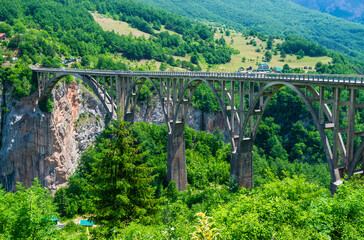 Concrete arch Durdevica Tara Bridge over Tara Canyon River in northern Montenegro.