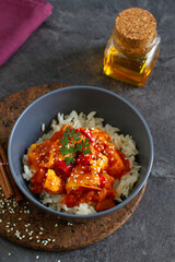 Sesame teriyaki chicken and ginger rice on a table