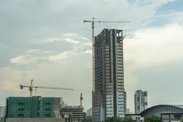 Fototapeta na wymiar building site with cranes and blue sky