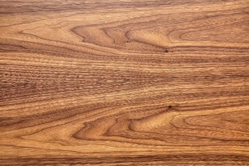 Wonderful walnut tree veneer texture with abstract patterns as background for design and decor close view from above