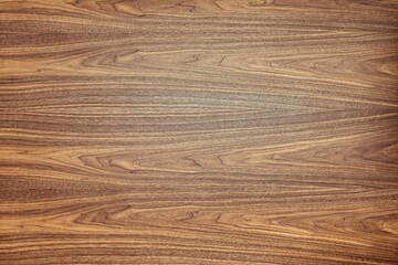 Wonderful walnut tree veneer texture with abstract patterns as background for design and decor close view from above