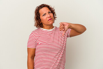 Middle age latin woman isolated on white background showing a dislike gesture, thumbs down....