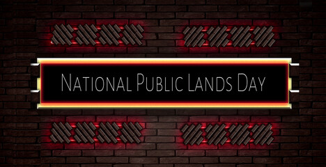 September month special day. National Public Lands Day, Neon Text Effect on Bricks Background