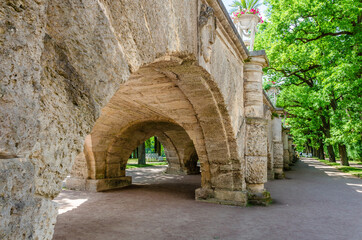 Fototapeta na wymiar Under the arch of the old stone bridge.