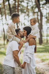 Fototapeta premium Family with baby daughter and little son in park