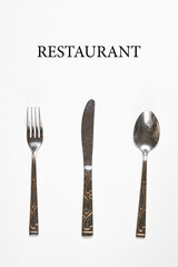 Restaurant eating items - Fork, spoon and knife on white background