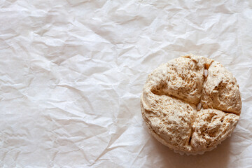 Vegetable based round halva sweet seeds prepared wax paper texture copy space background.