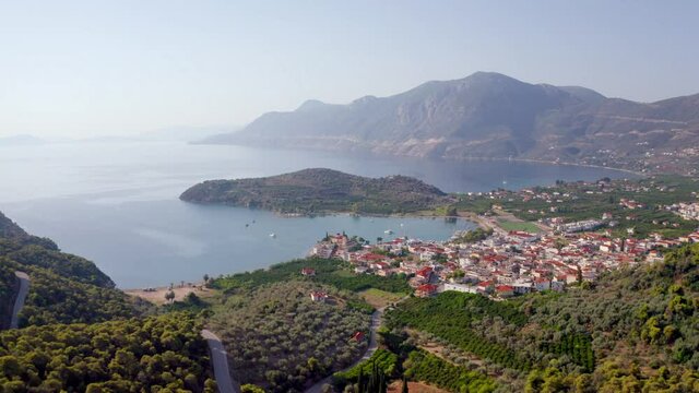 4k drone forward video (Ultra High Definition) of Palaia Epidavros, small town in the Argolis prefecture of the Peloponnese, Greece. Aerial summer seascape of Ionian sea.