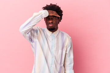 Young african american man isolated on pink background touching temples and having headache.