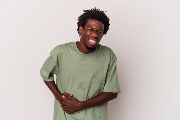 Young african american man isolated on white background  having a liver pain, stomach ache.
