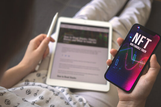 Businesswoman using NFT crypto art in real life. Business and digital technology, e-business and blockchain