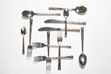 Restaurant eating items - Fork, spoon and knife on white background