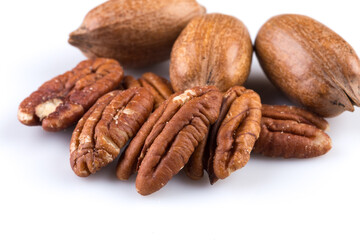 Few pecan nuts isolated on white